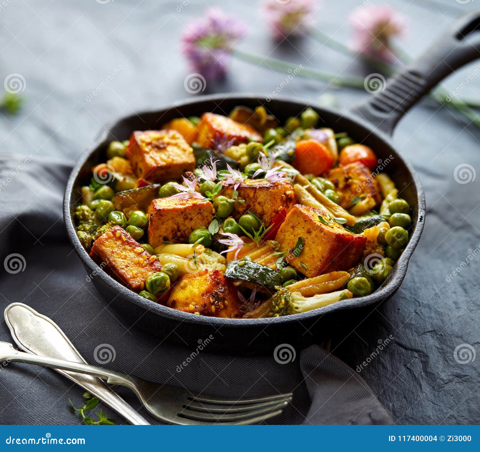 Tofu with Vegetables Sprinkled with Herbs and Edible Flowers. Vegan