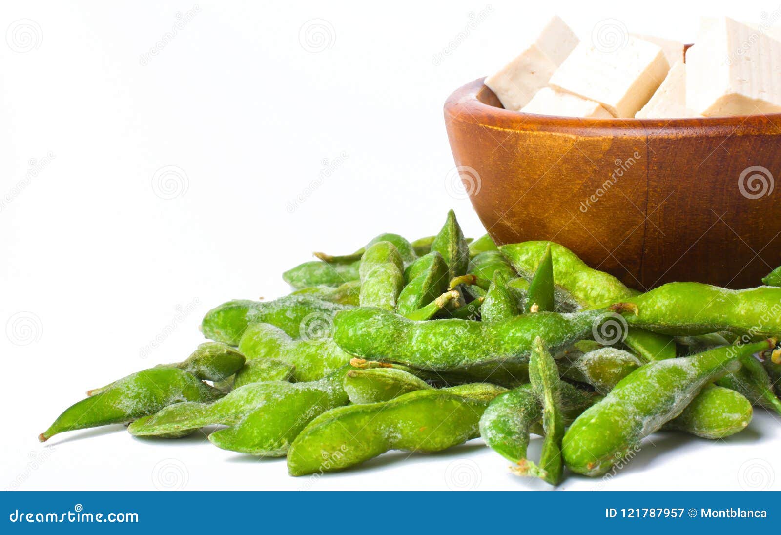 Tofu in Wooden Bowl with Green Edamame on White Background Stock Image