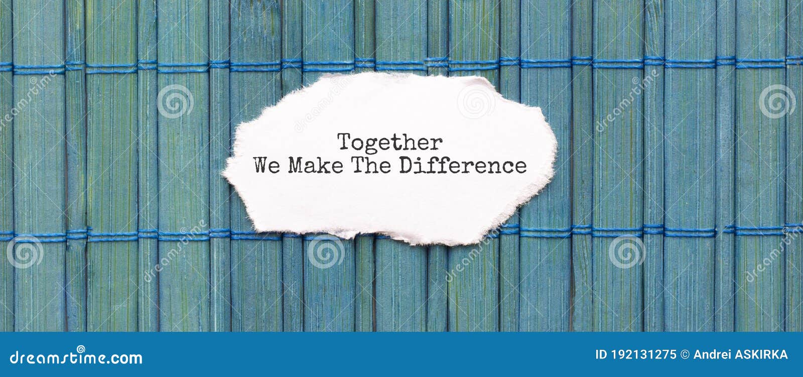 together we make the difference text on the piece of paper on the green wood background