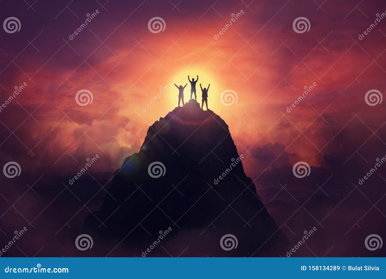 together overcoming obstacles as a group of three people raising hands up on the top of a mountain. celebrate victory and success