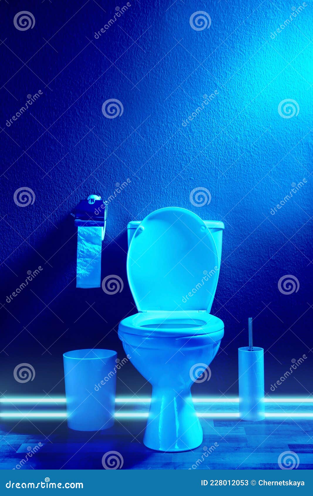 Toilet Bowl in Public Restroom Lit with UV Blue Light Stock Image