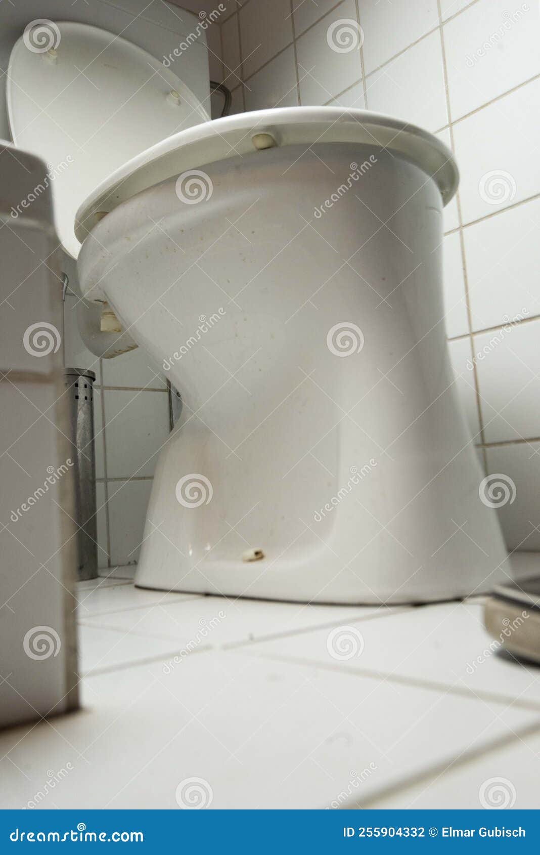 A toilet in a restroom stock photo. Image of toilet 255904332