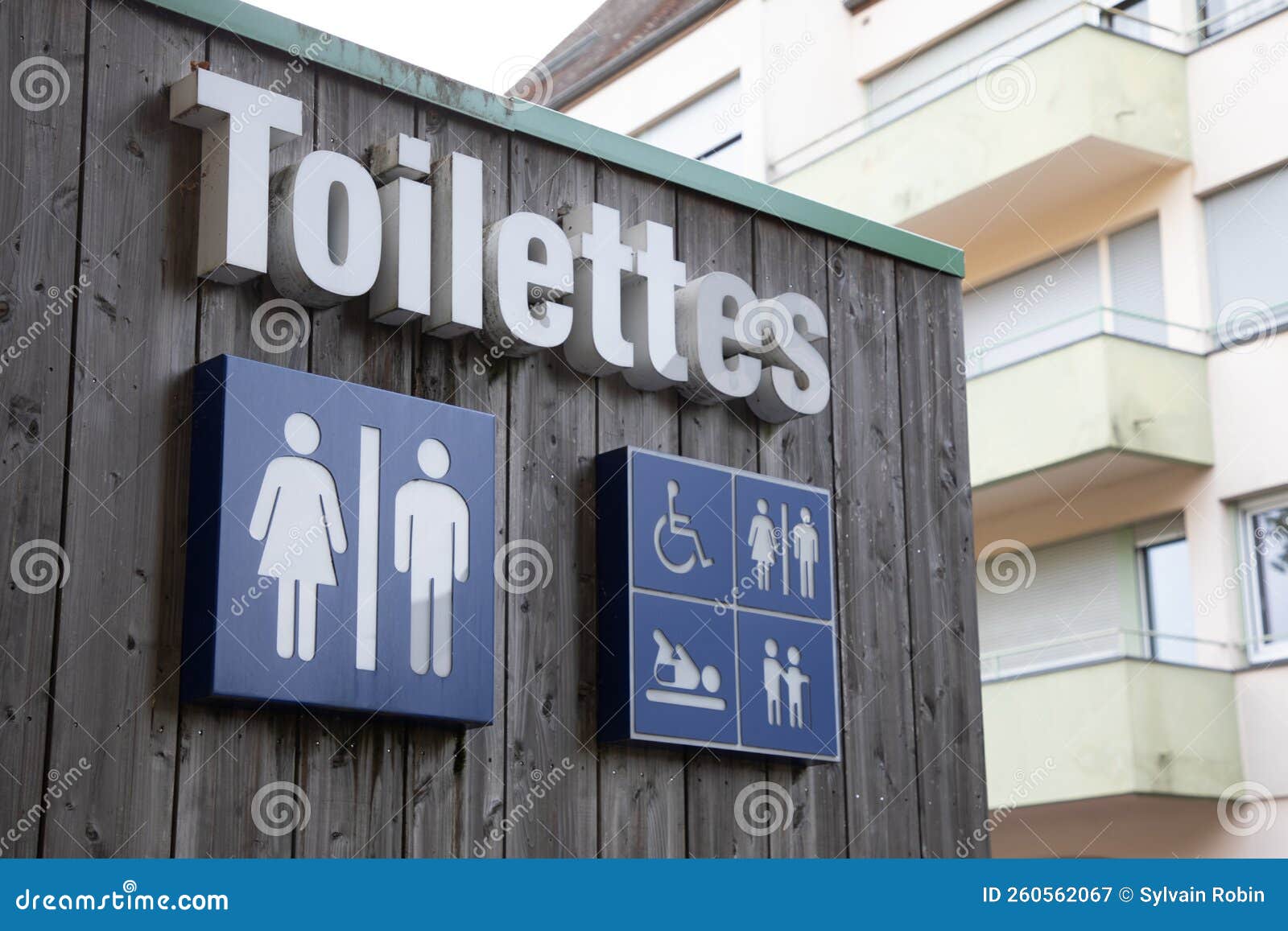toilettes french text means wc toilet sign icon on wooden building facade water-closets wall entrance