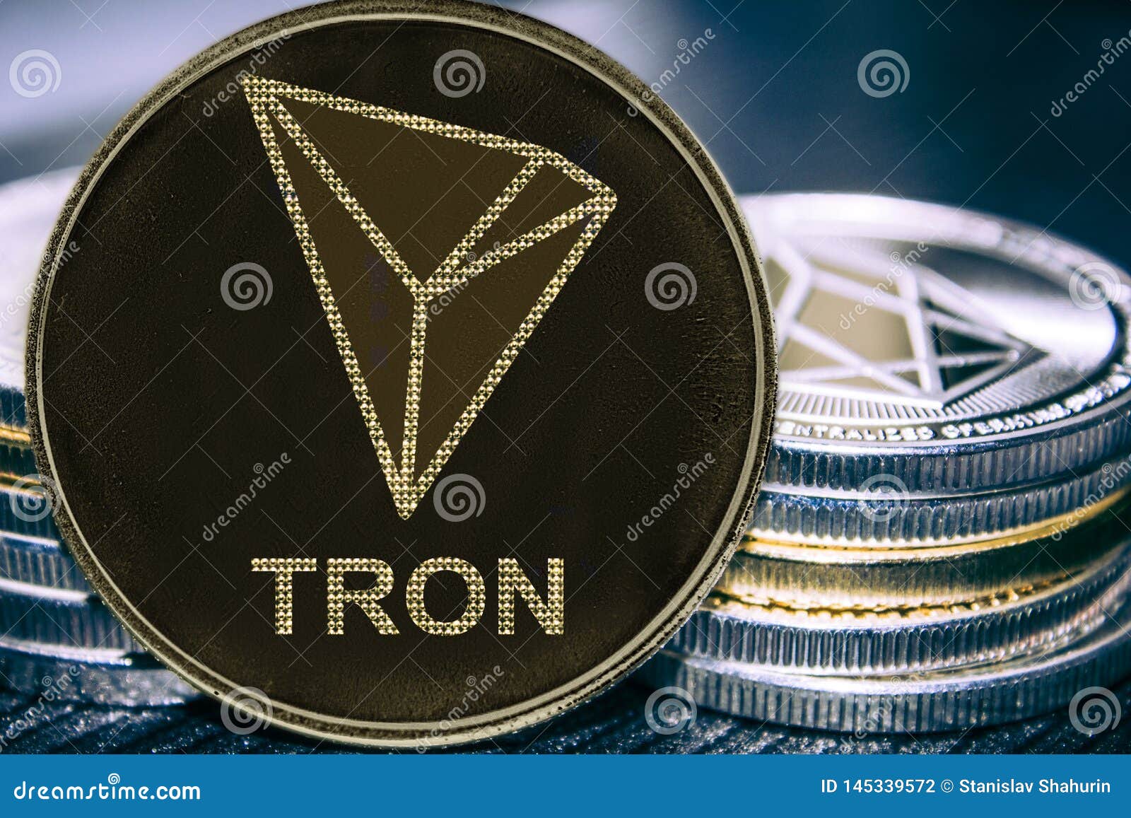 Token Cryptocurrency Tron TRX On The Background Of A Stack ...