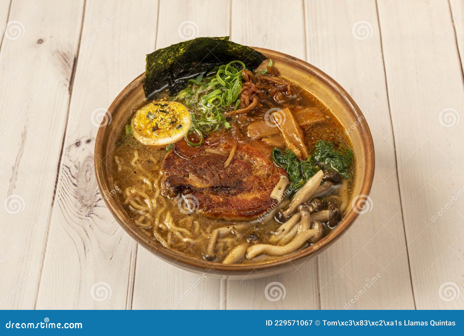 tokio ramen with meat, noodles, mushrooms and seaweed cooked