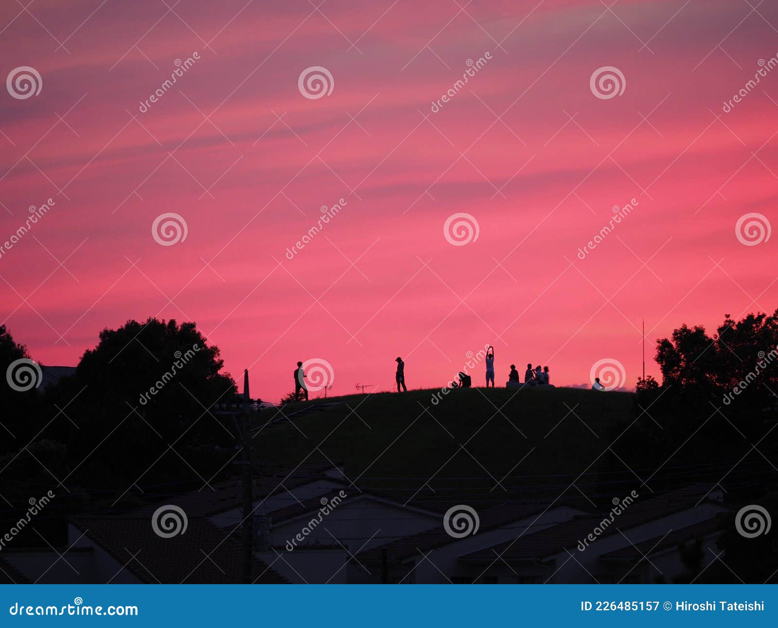 Silhouette of the People Watching the Red Sky at Sunset on the Hill ...