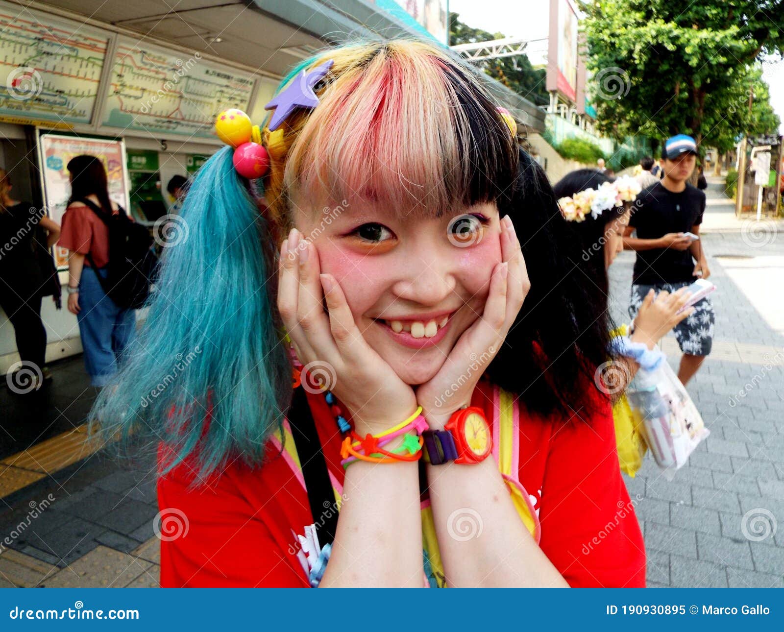 Tokyo, Japan, July 20, 2016: A Japanese girl poses on Takeshita Street in the Harajuku district. This street is famous for anime and manga clothing and accessories stores