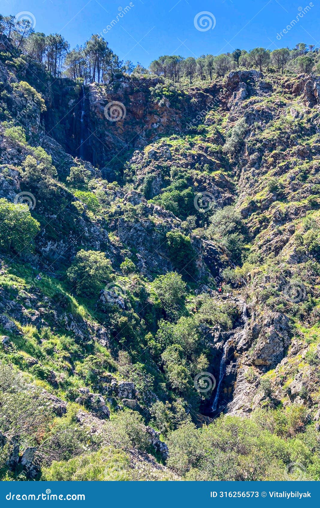 hiking trail to waterfalls over river caballos, sierra de la nieves national park in tolox, malaga