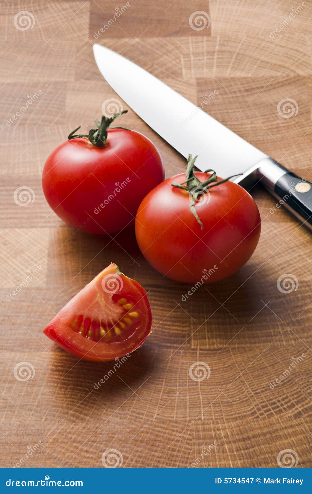 Tomatoes and knife stock image. Image of wedge, vertical 5734547
