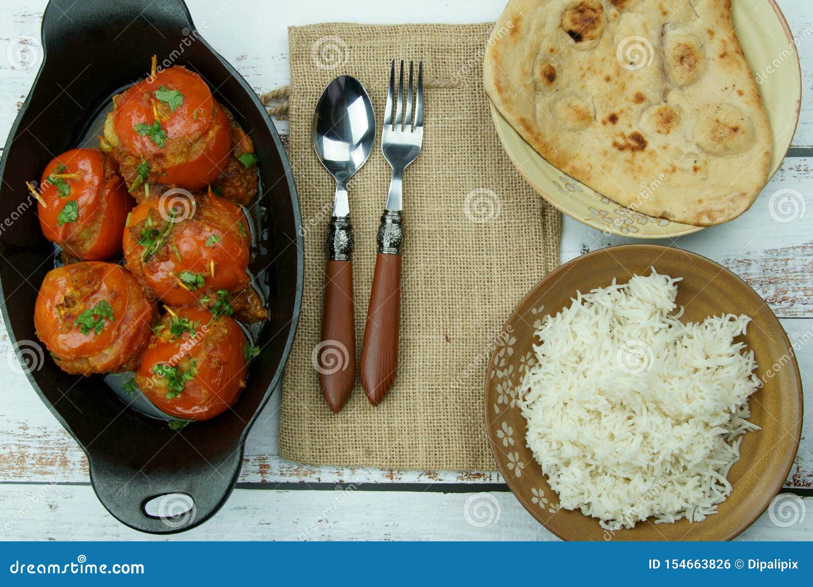 Tomatoes Stuffed with a Spicy Mixture of Mashed Potatoes in an Indian