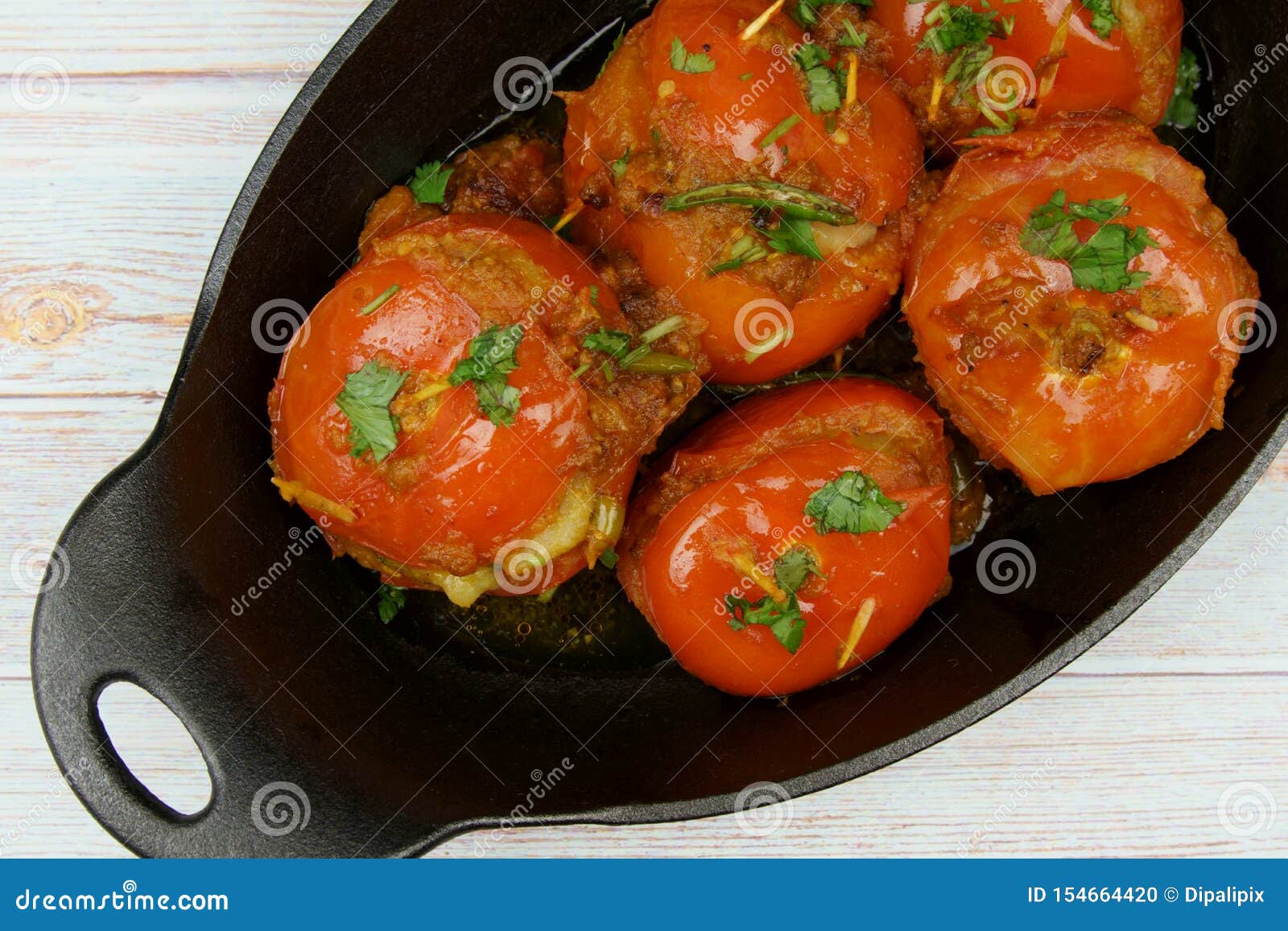 Tomatoes Stuffed with a Spicy Mixture of Mashed Potatoes in an Indian