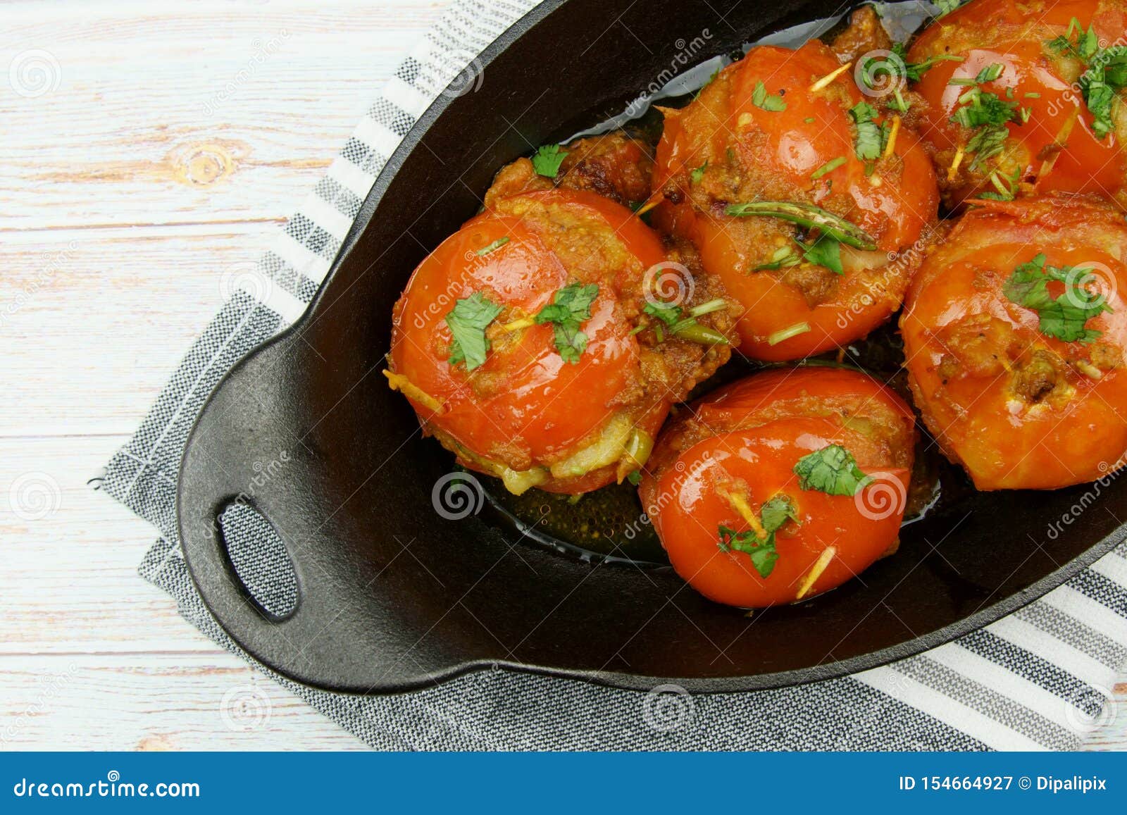 Tomatoes Stuffed with a Spicy Mixture of Mashed Potatoes in an Indian