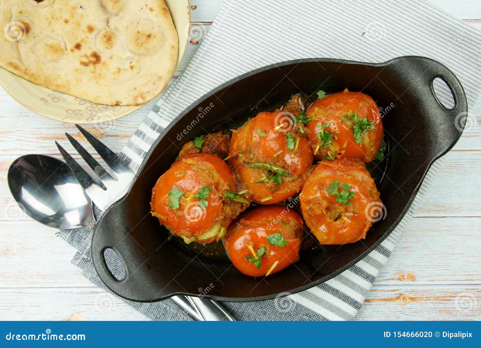 Tomatoes Stuffed with a Spicy Mixture of Mashed Potatoes in an Indian