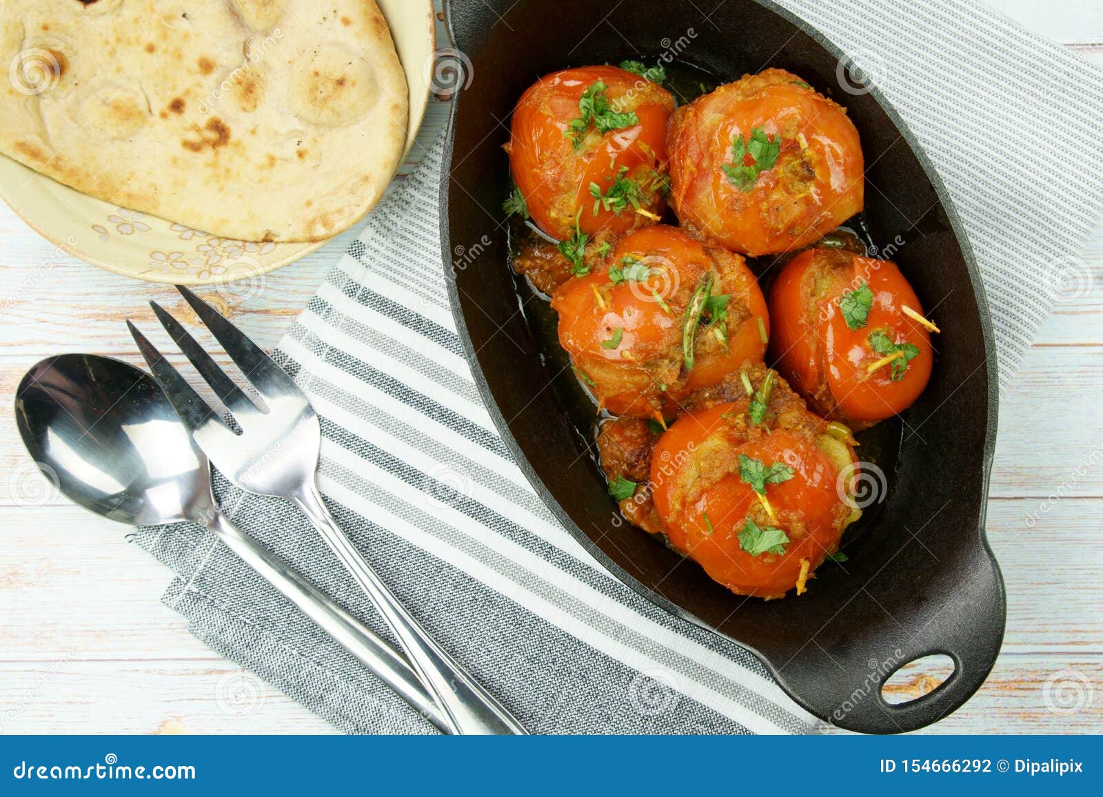 Tomatoes Stuffed with a Spicy Mixture of Mashed Potatoes in an Indian