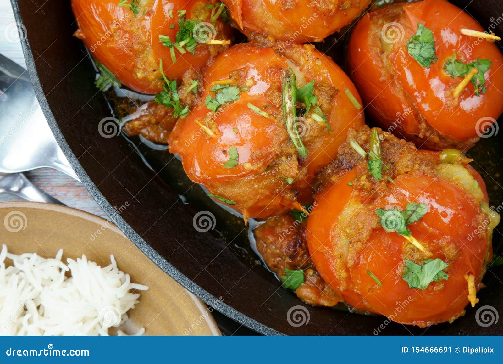 Tomatoes Stuffed with a Spicy Mixture of Mashed Potatoes in an Indian