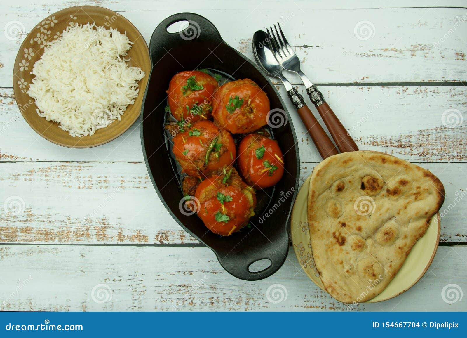 Tomatoes Stuffed with a Spicy Mixture of Mashed Potatoes in an Indian