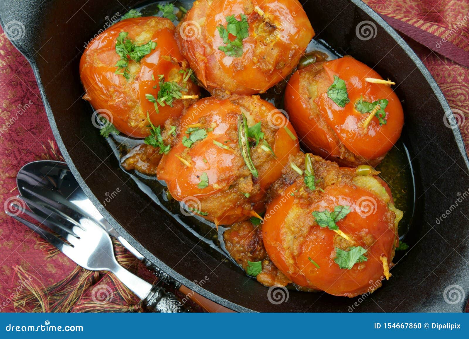 Tomatoes Stuffed with a Spicy Mixture of Mashed Potatoes in an Indian