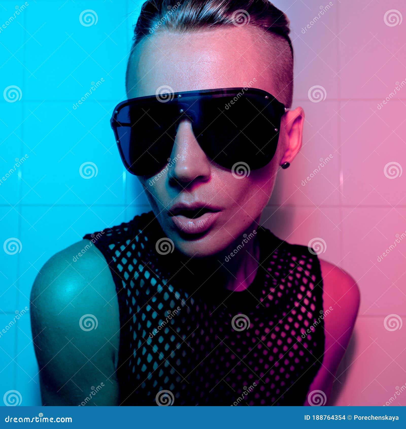 Tomboy Girl with Short Hair and Luxury Sunglasses. Fashion Party Style Club  Neon Light Stock Photo - Image of clothing, swag: 188764354