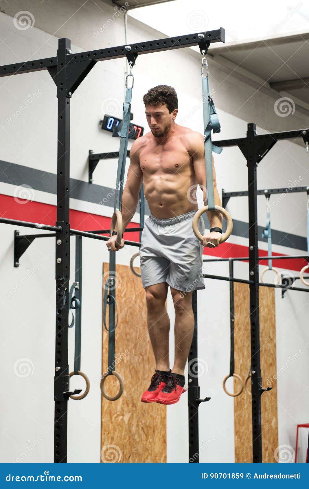 Toned Bodybuilder Exercising with Rings Stock Image Image of muscular