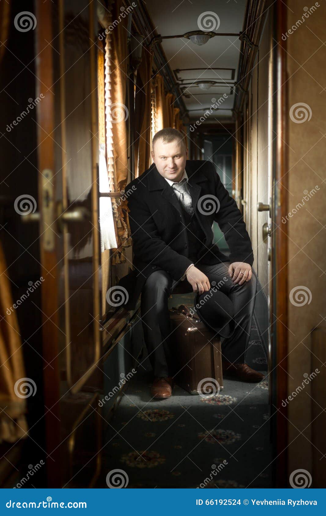 Toned Shot of Man in Vintage Suit Posing in Train Stock Photo Image