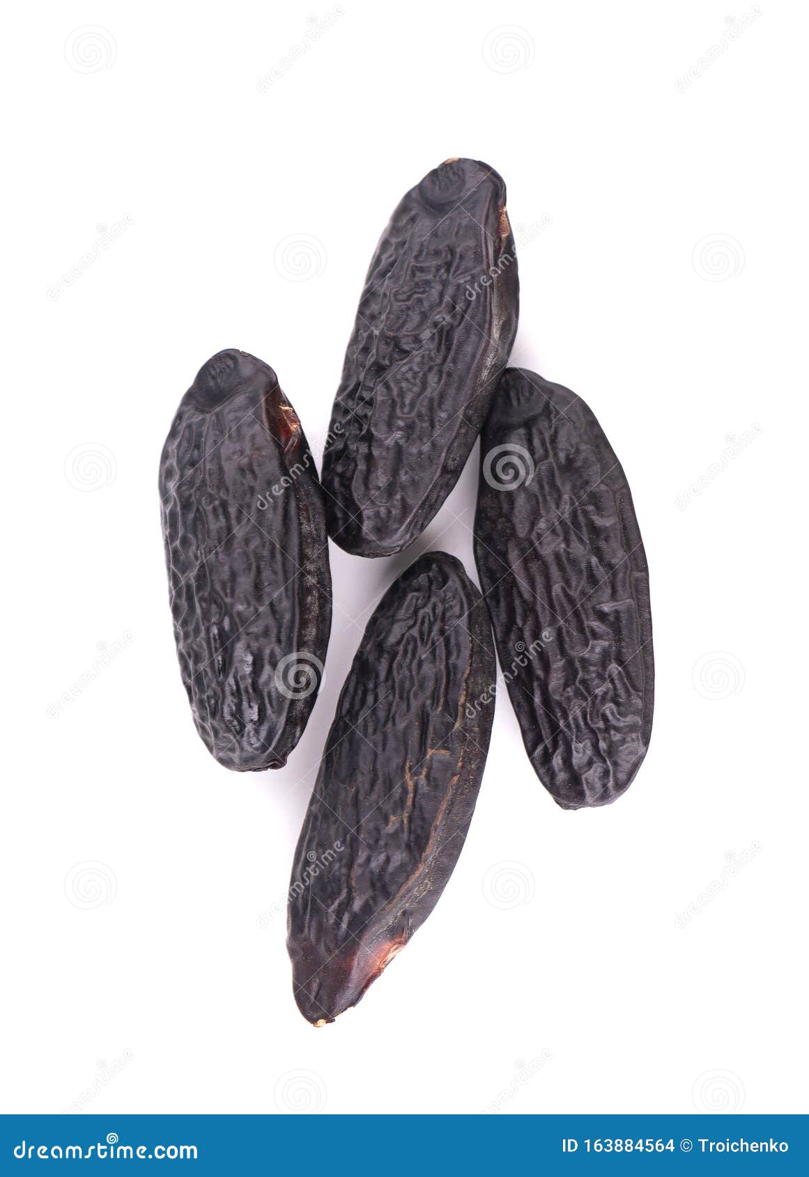 tonka beans  on white background. bean of dipteryx odorata, cumaru or kumaru. fresh aroma tonka beans. close-up.