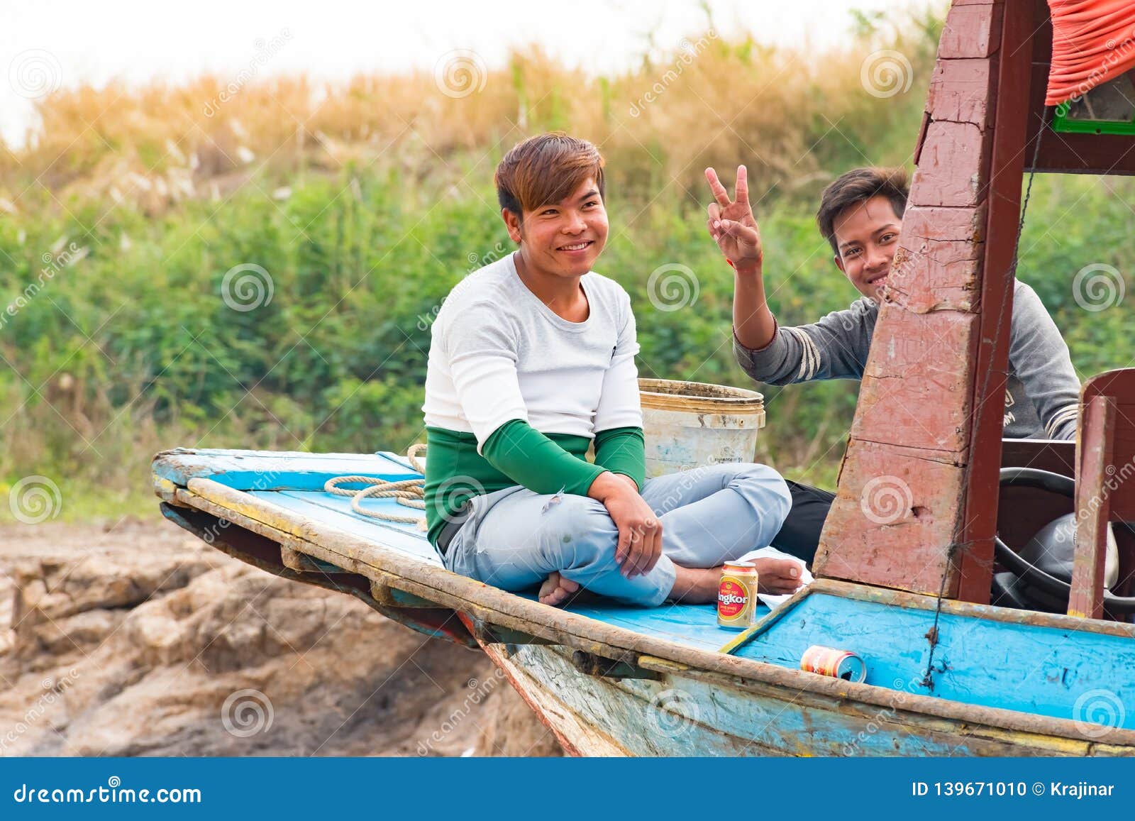 Boat Swinging Boy At Tonle Sap Lake Fishing Village 
