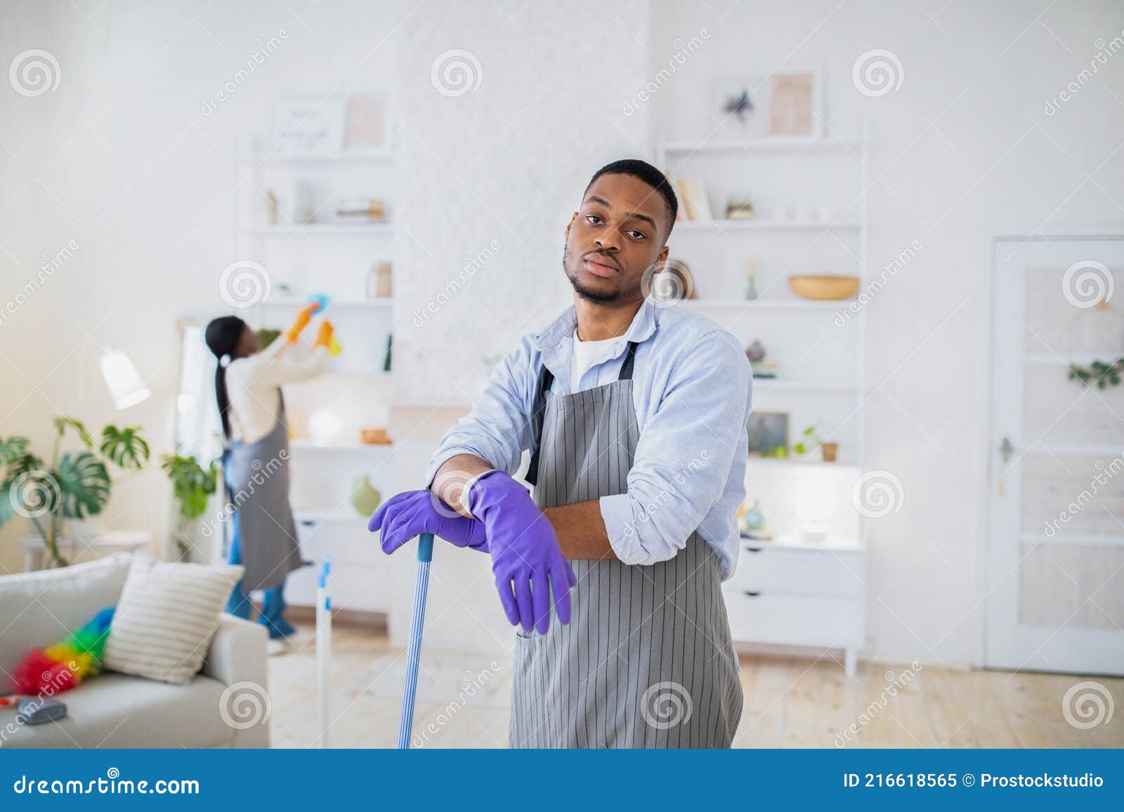 Too much domestic work. Tired black guy feeling bored of cleaning