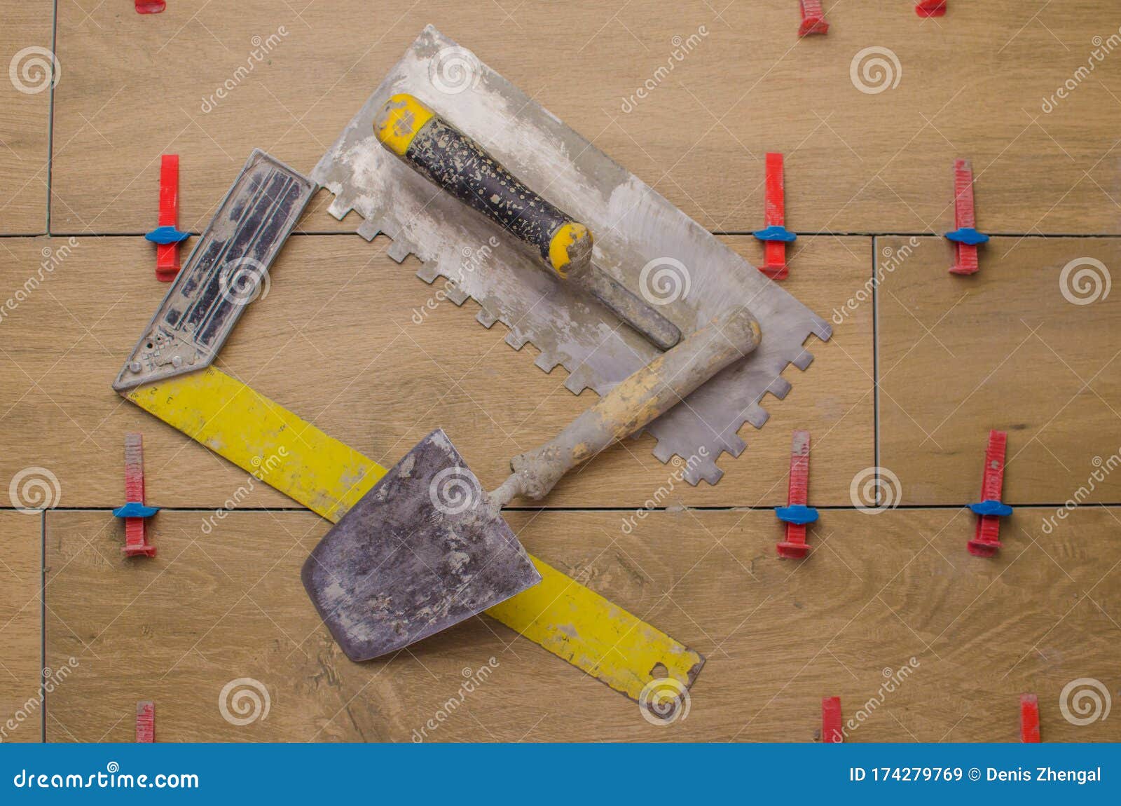 a tool for laying ceramic tiles in the form of a tree.trowel, toothed trowel, tile alignment clips. svp