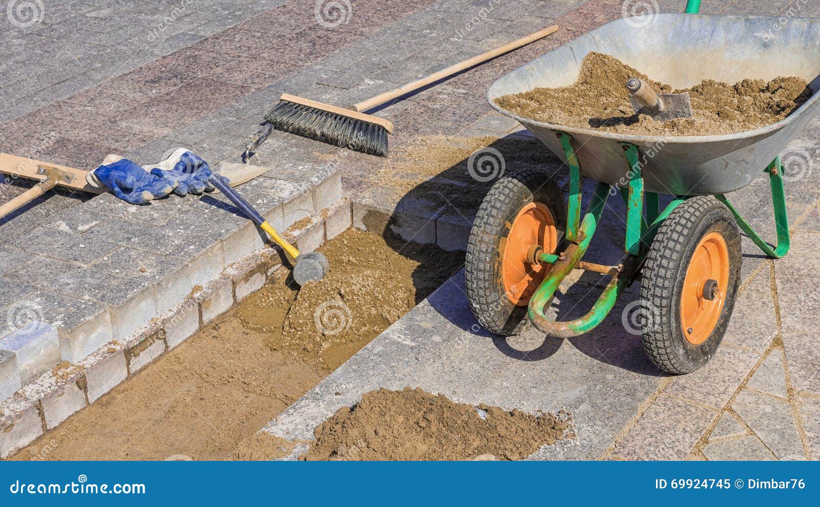 Tool for Laying Paving Slabs on a Background of Granite Bricks and Sand