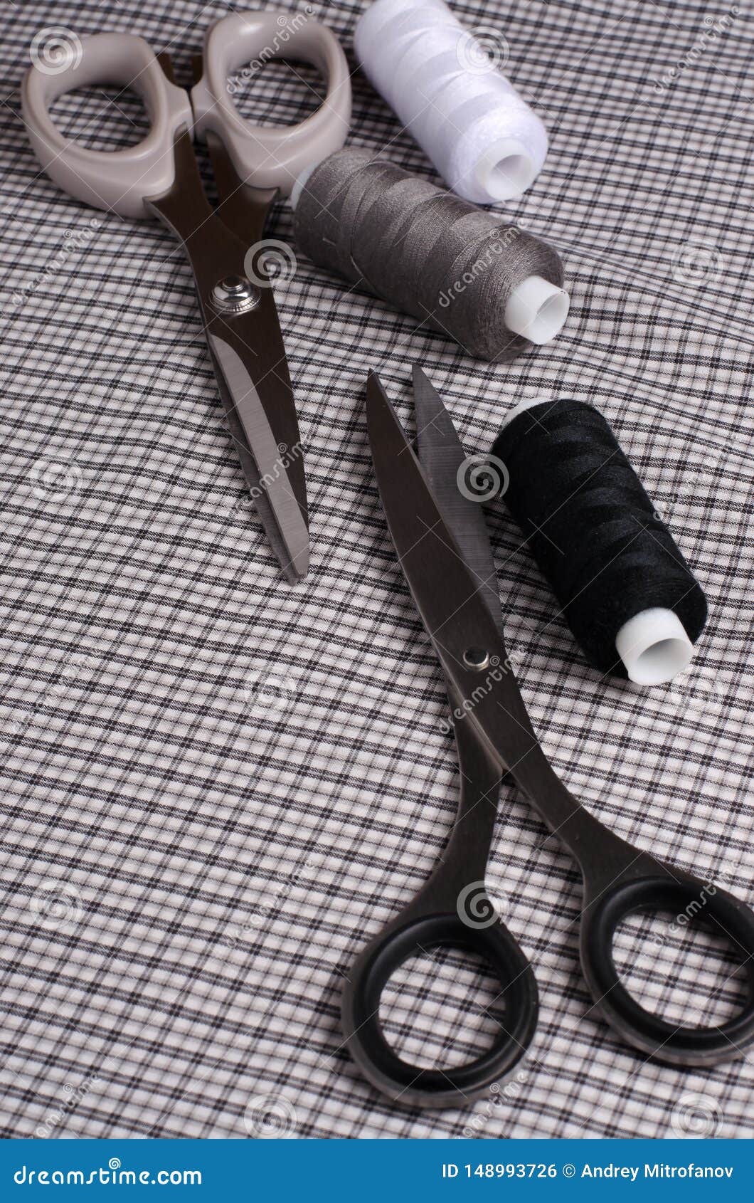 Tools and Accessories for Sewing. Sewing Thread, Scissors on Gra Stock