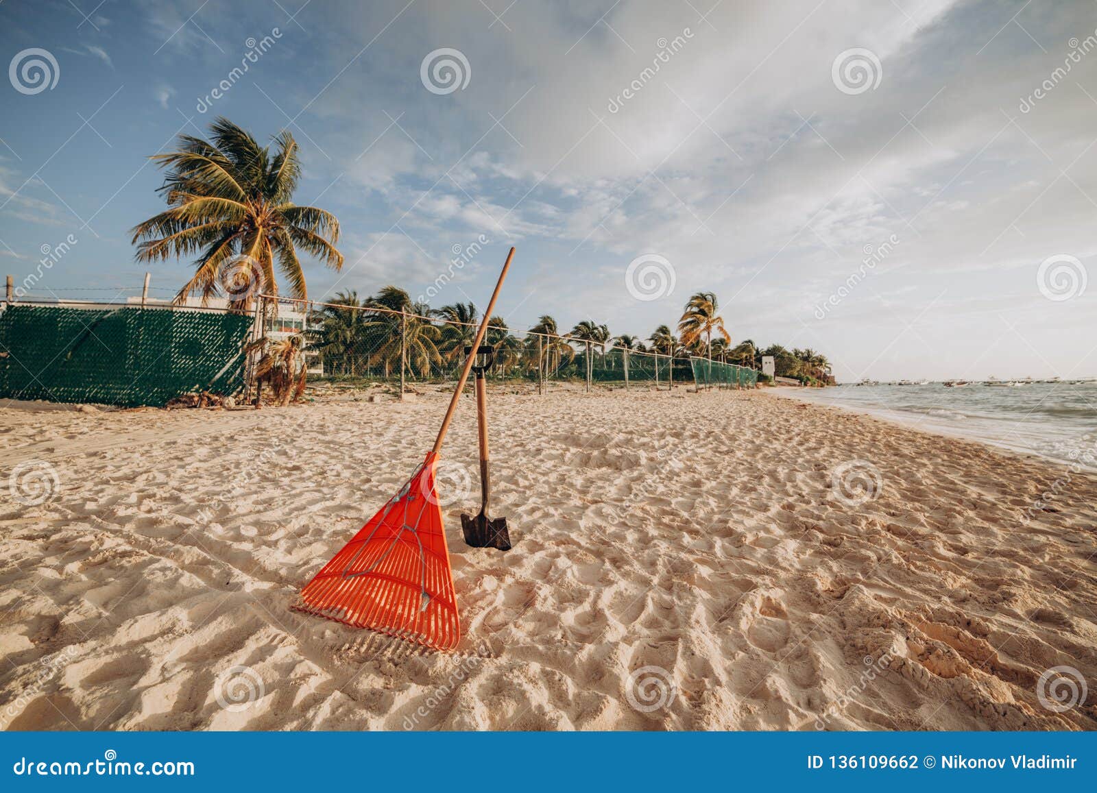 Tools for Cleaning the Beach. Rake and Shovel on Sand Stock Photo - Image  of resort, outdoor: 136109662