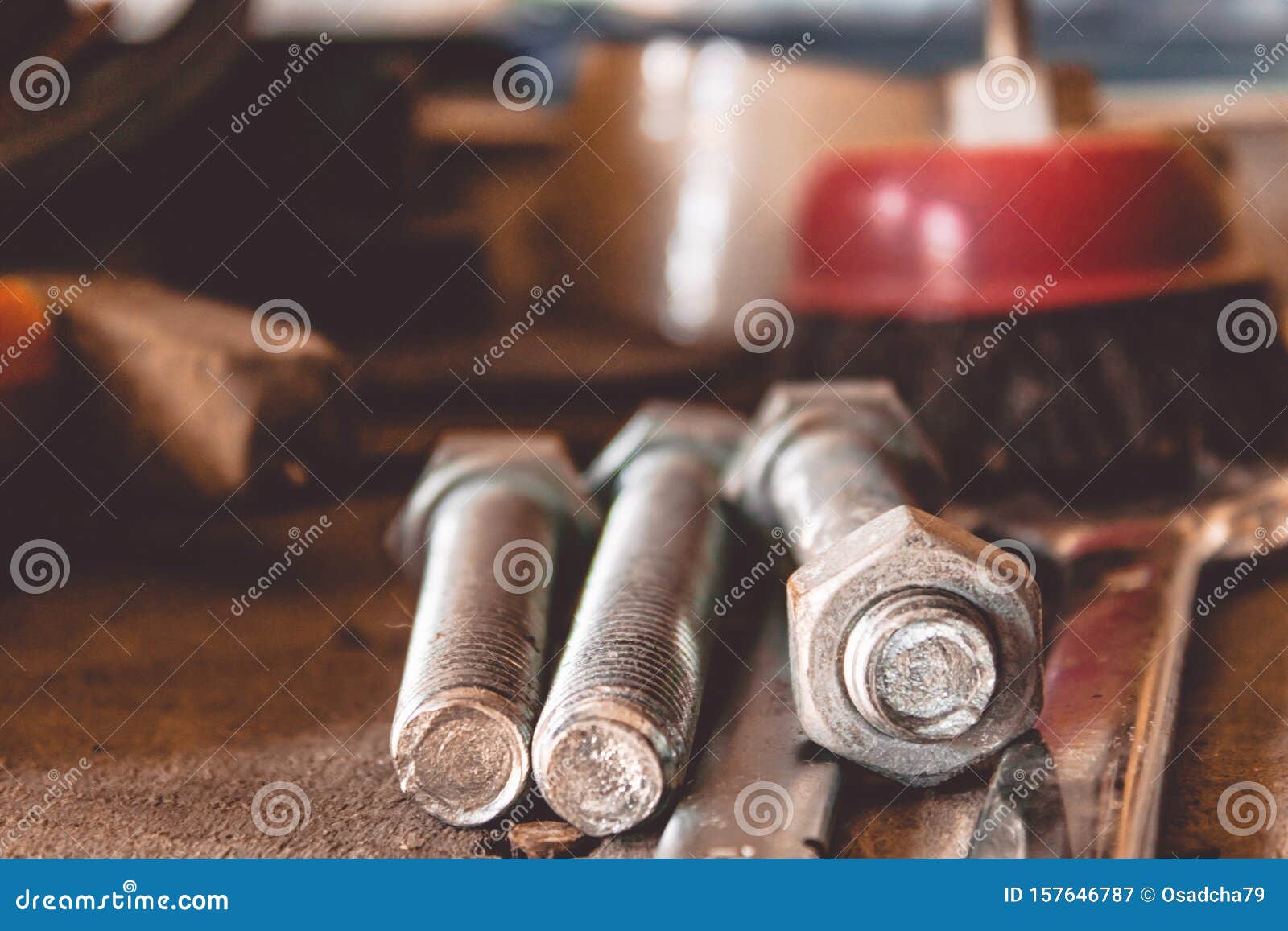 Tools for the Job. Bolts and Nut with Wrench are on the Table Stock