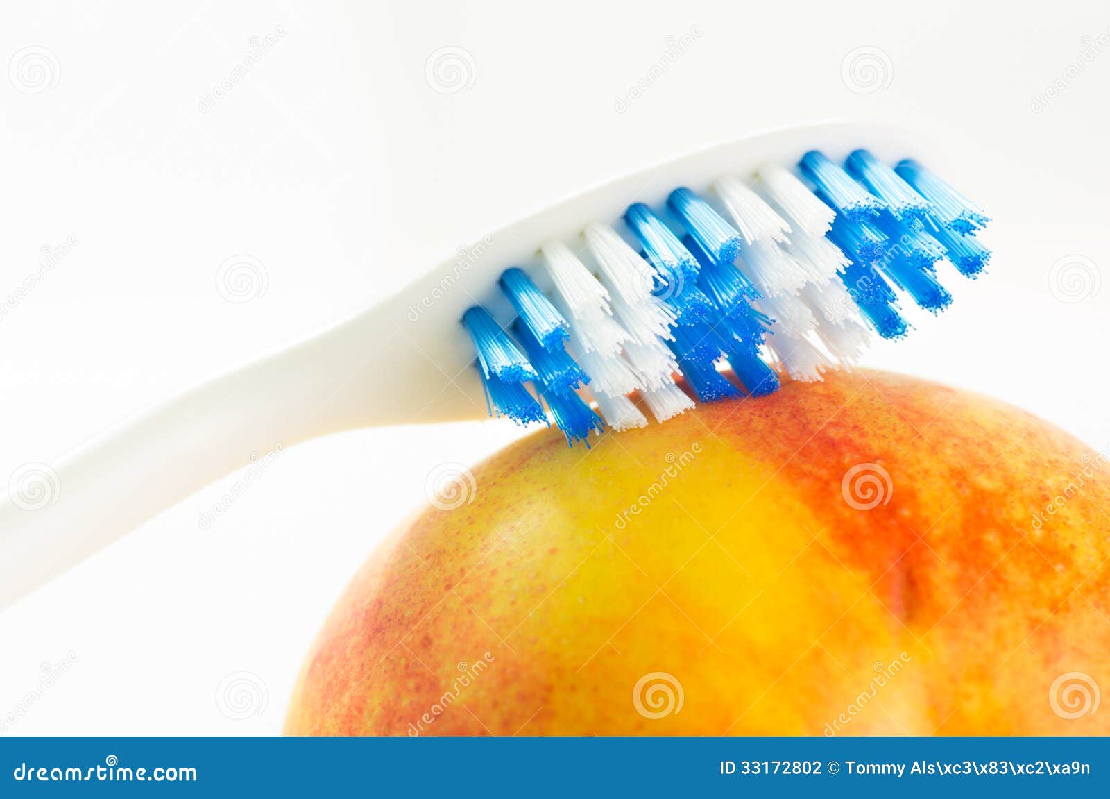Toothbrush on fruit stock photo. Image of hygiene, concept 33172802