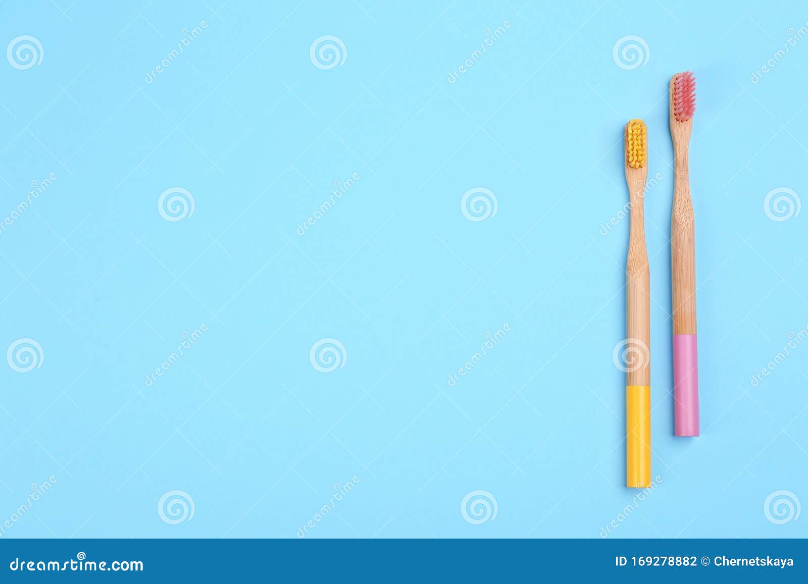 Toothbrushes Made of Bamboo on Light Blue Background, Flat Lay. Space ...
