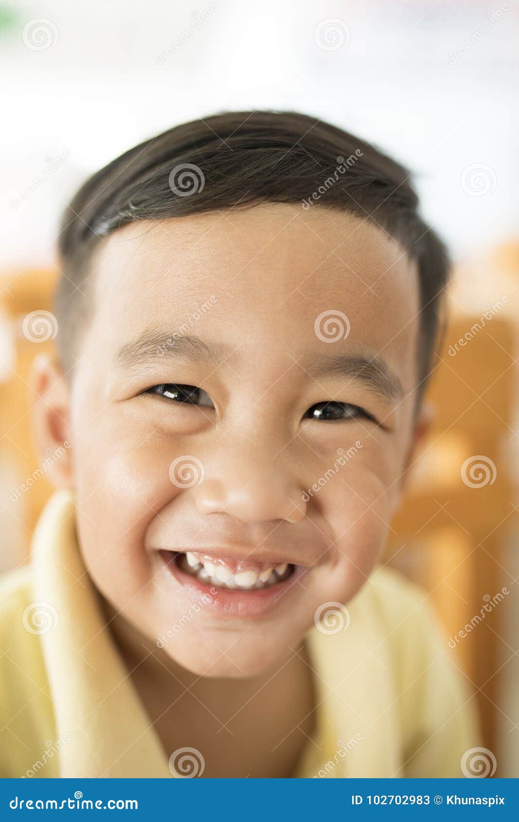 toothy smiling face happiness emotion of asian children shallow