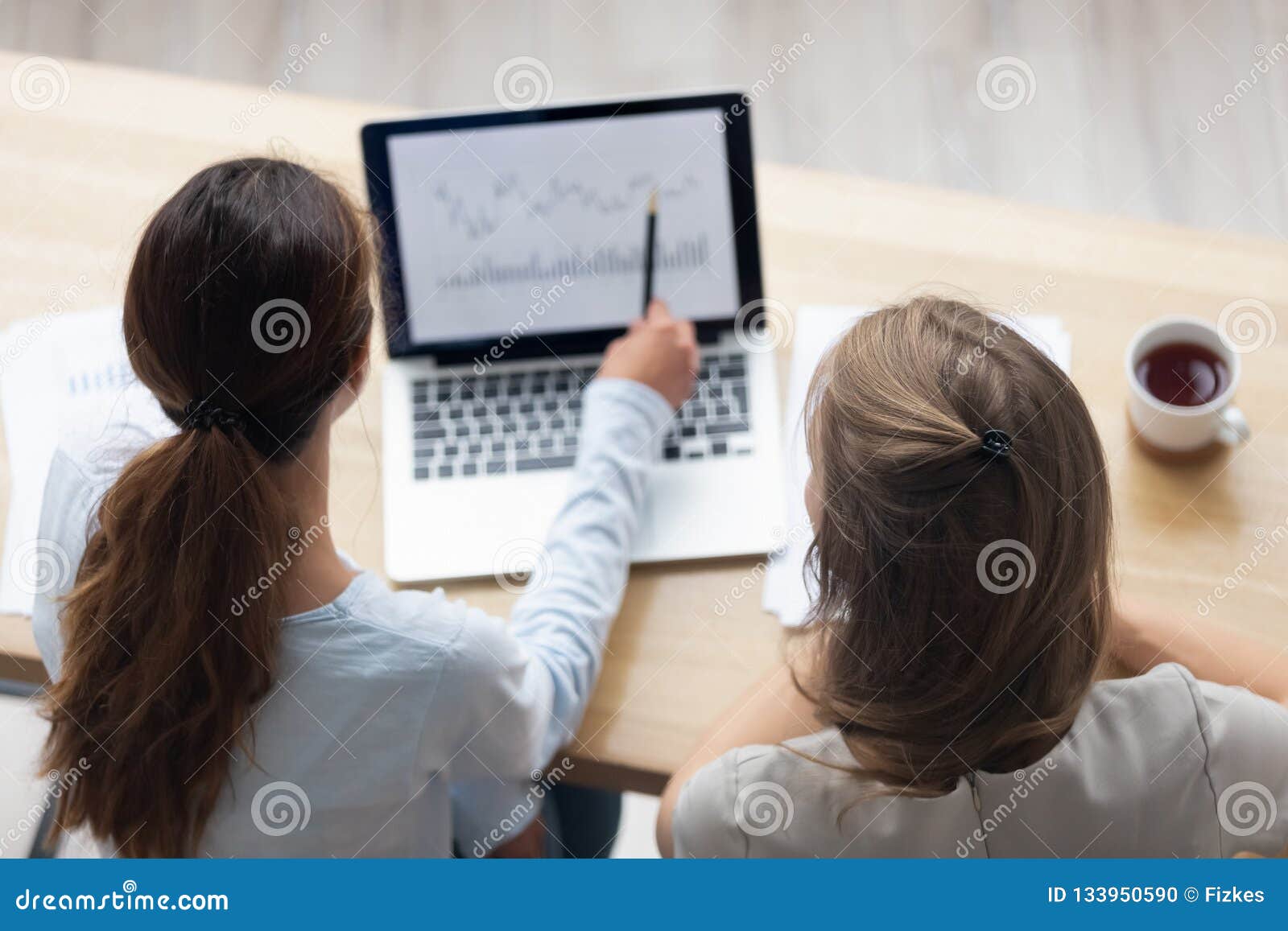 top above view businesswomen working with computer program