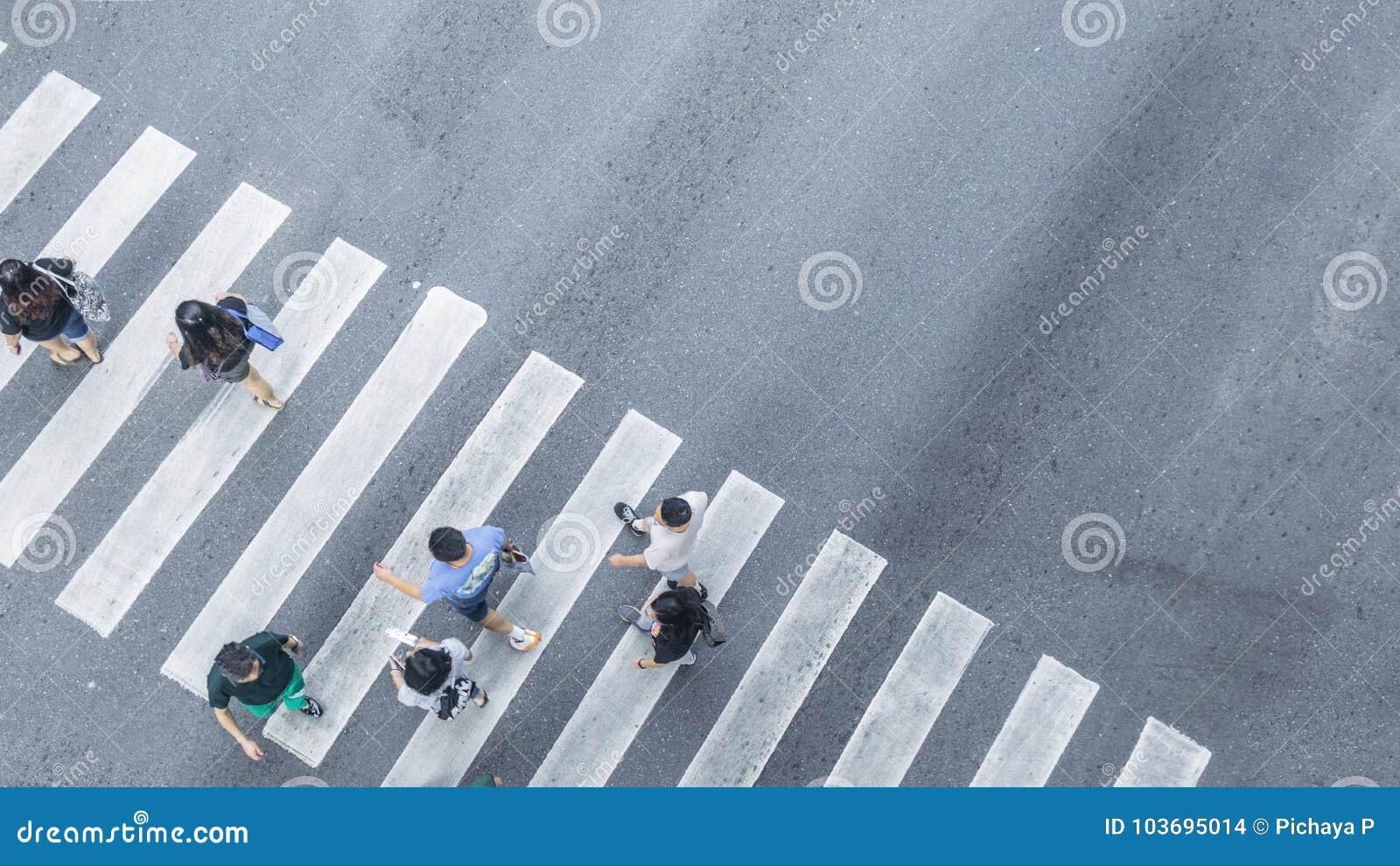 the from the top crosswise view of people walk on street pedestrian crossroad in the city street ,bird eye view.