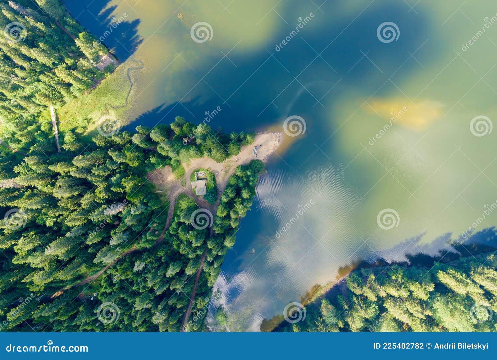 Top Down Aerial View of Big Lake with Clear Blue Water between High ...