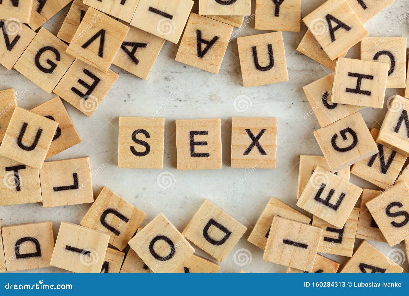 Top Down View Pile Of Square Wooden Blocks With Word Sex On White