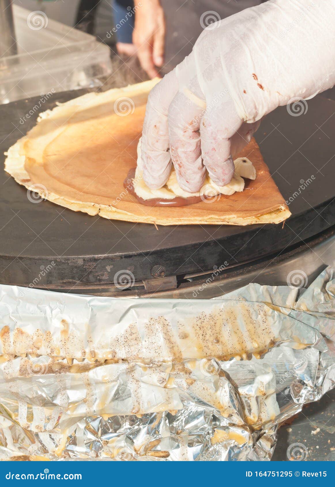 vender preparing a mushroom filled,french crepe