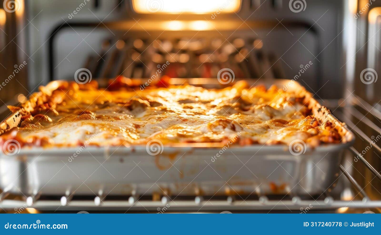 the top heating  of a convection oven browning the top of a cheesy lasagna