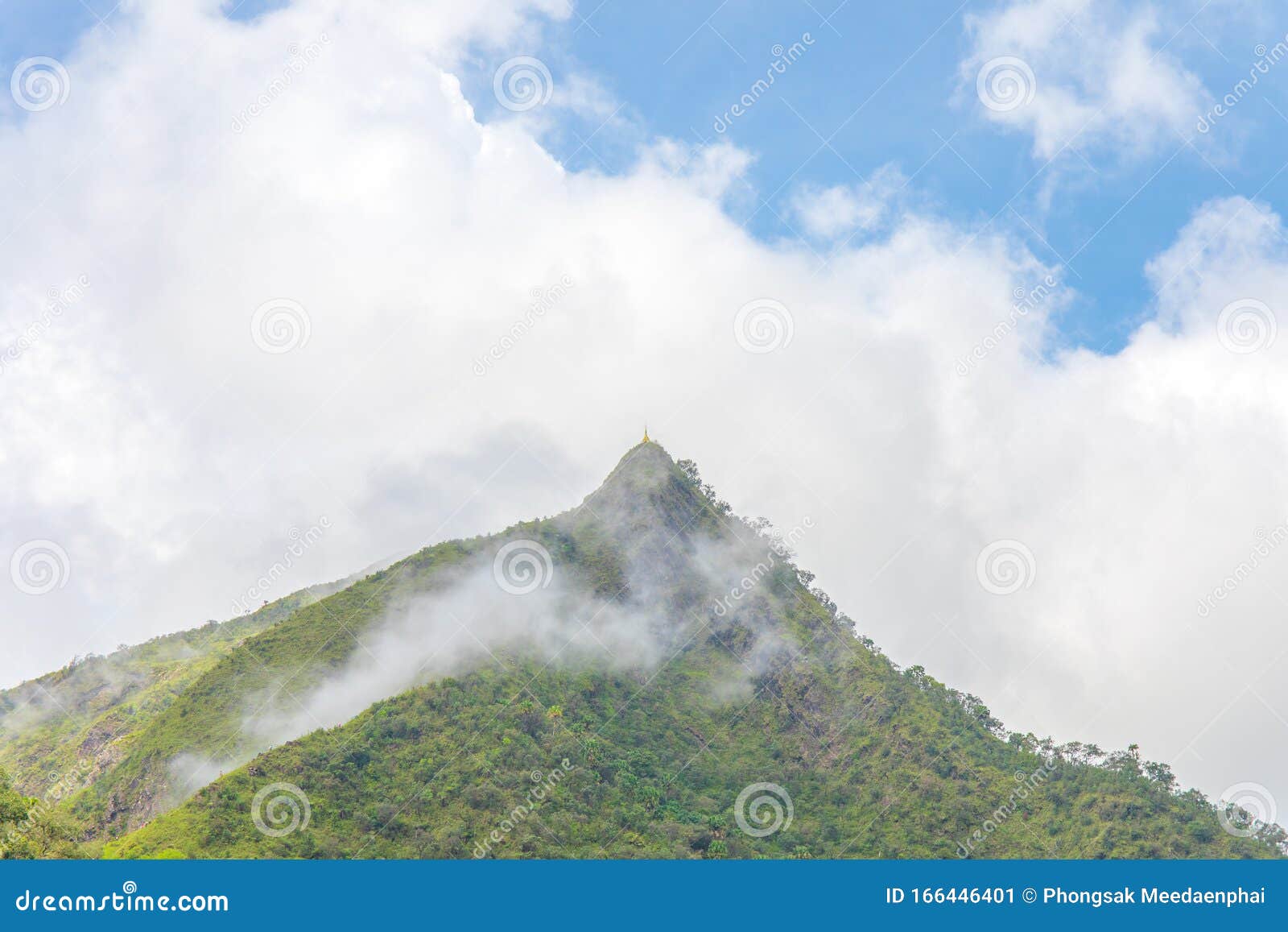 top of peak mountain forest with white clouds or fog and blue sky of `lerguada` or `ler gwa dor` tak province, thailand, asia.