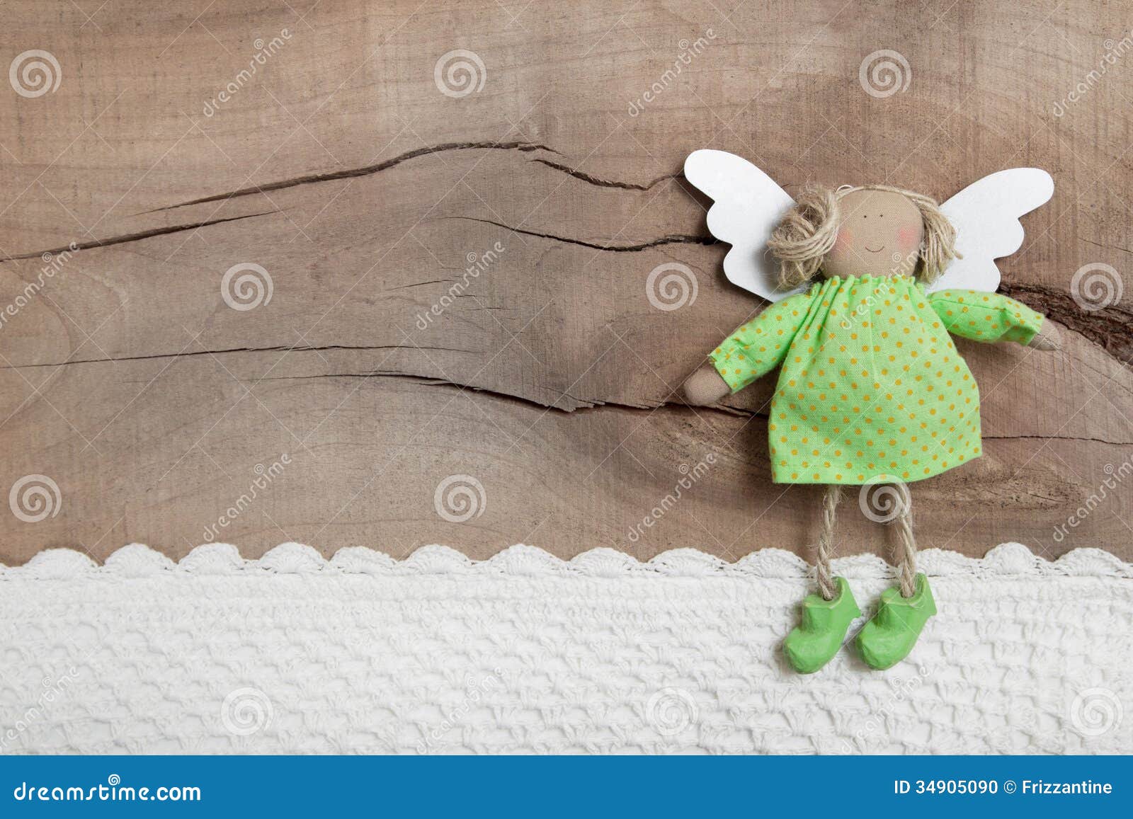 Top View Of Angel With Crochet Strip On Wooden Background 
