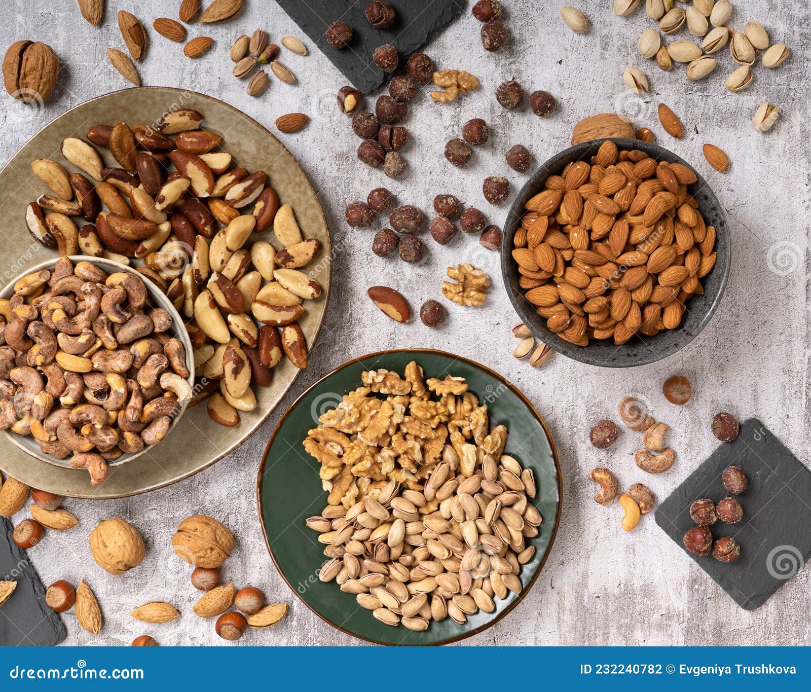Top View of Assorted Different Types of Nuts on a Plate Stock Photo