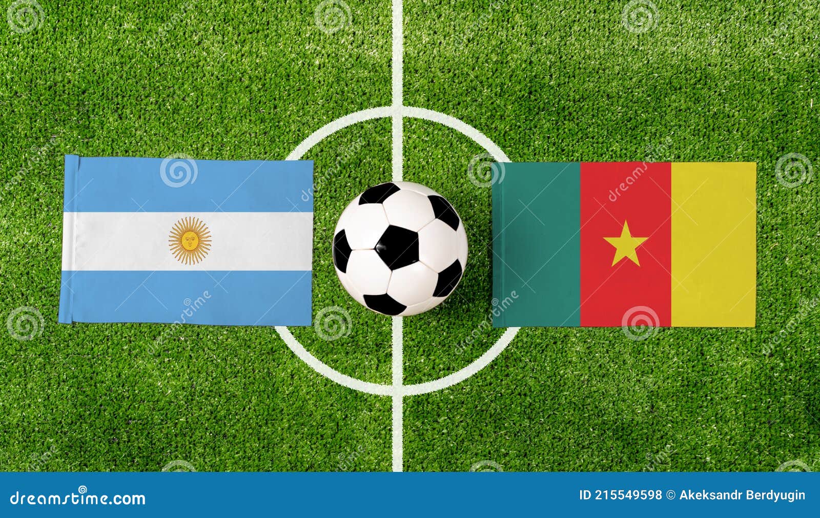 Top View Ball with Argentina Vs. Cameroon Flags Match on Green Soccer