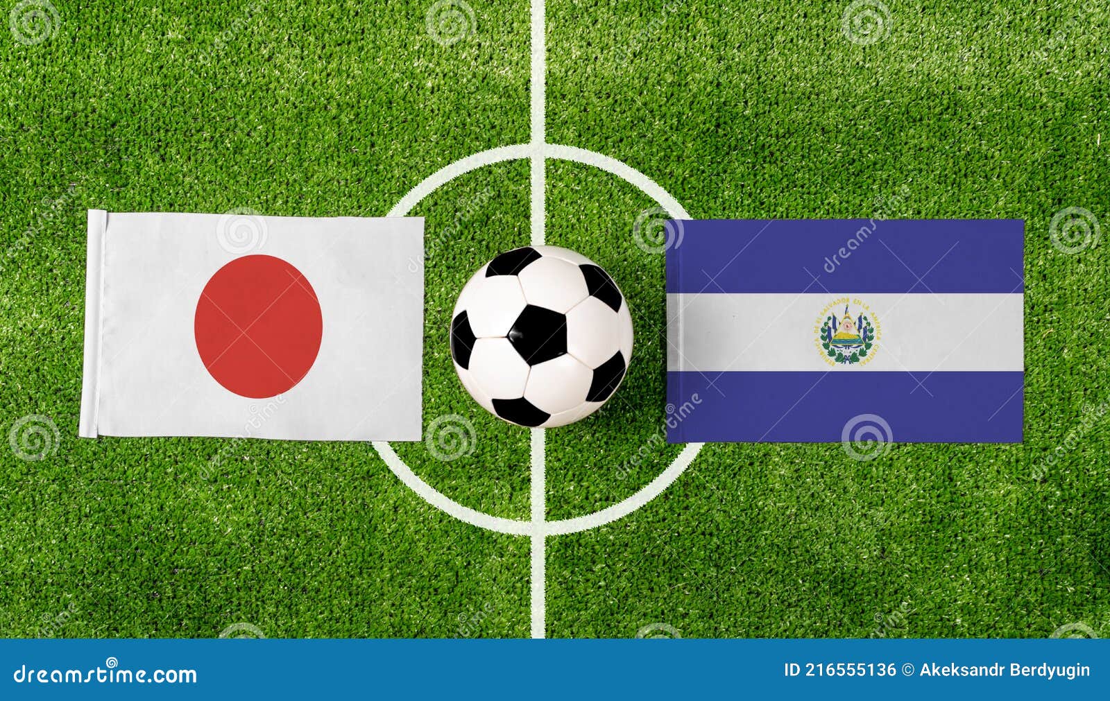 Top View Ball with Japan Vs. El Salvador Flags Match on Green Football