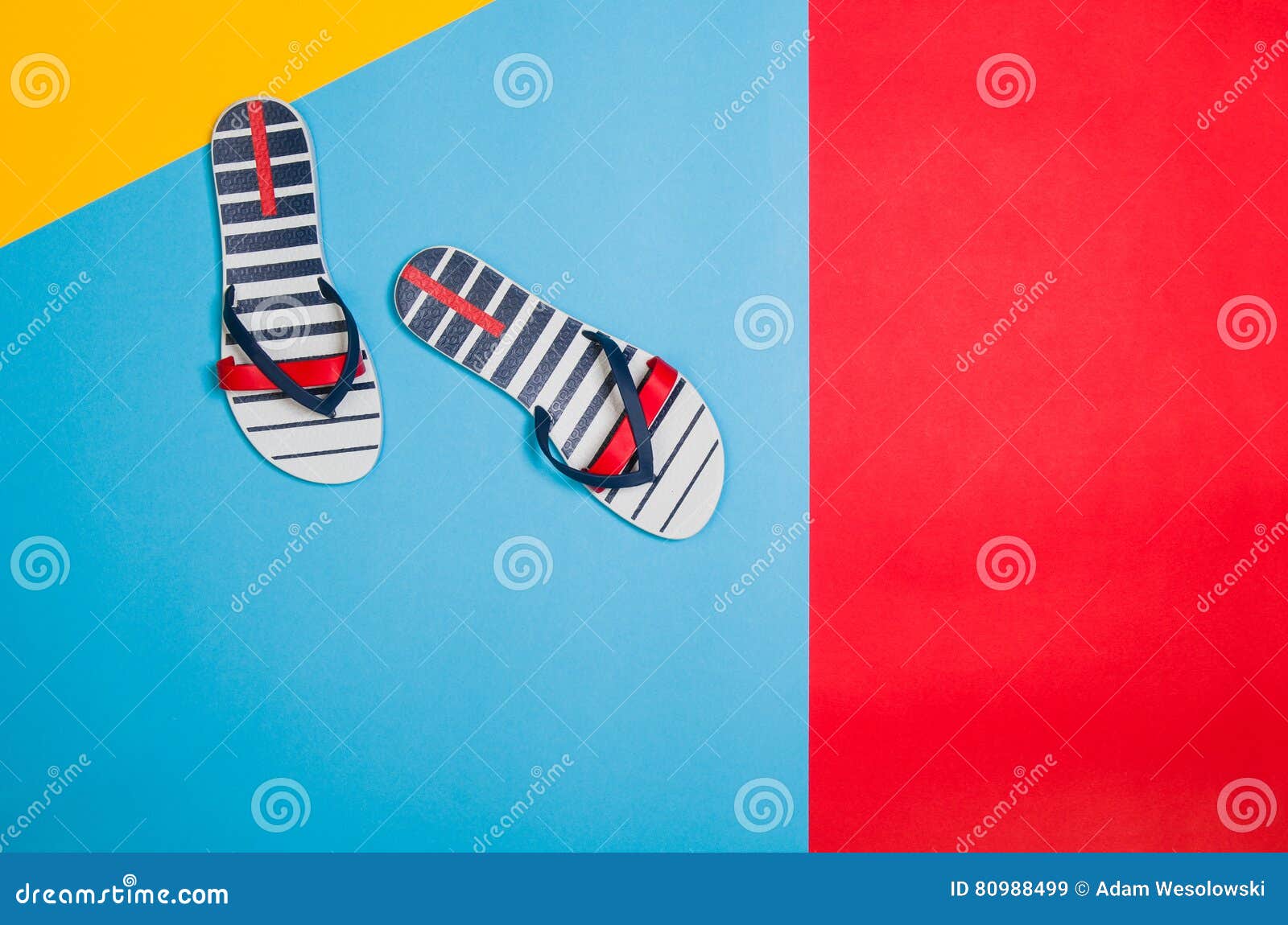 top view of beach with accessories on colourful graphical background
