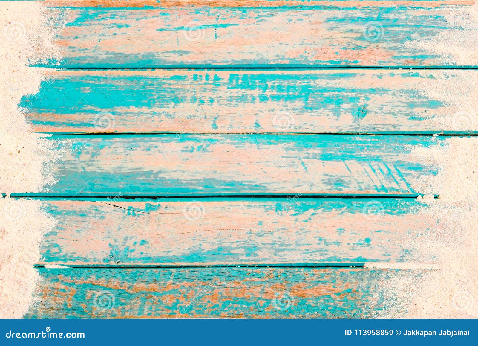 top view of beach sand on old wood plank in blue sea paint background.