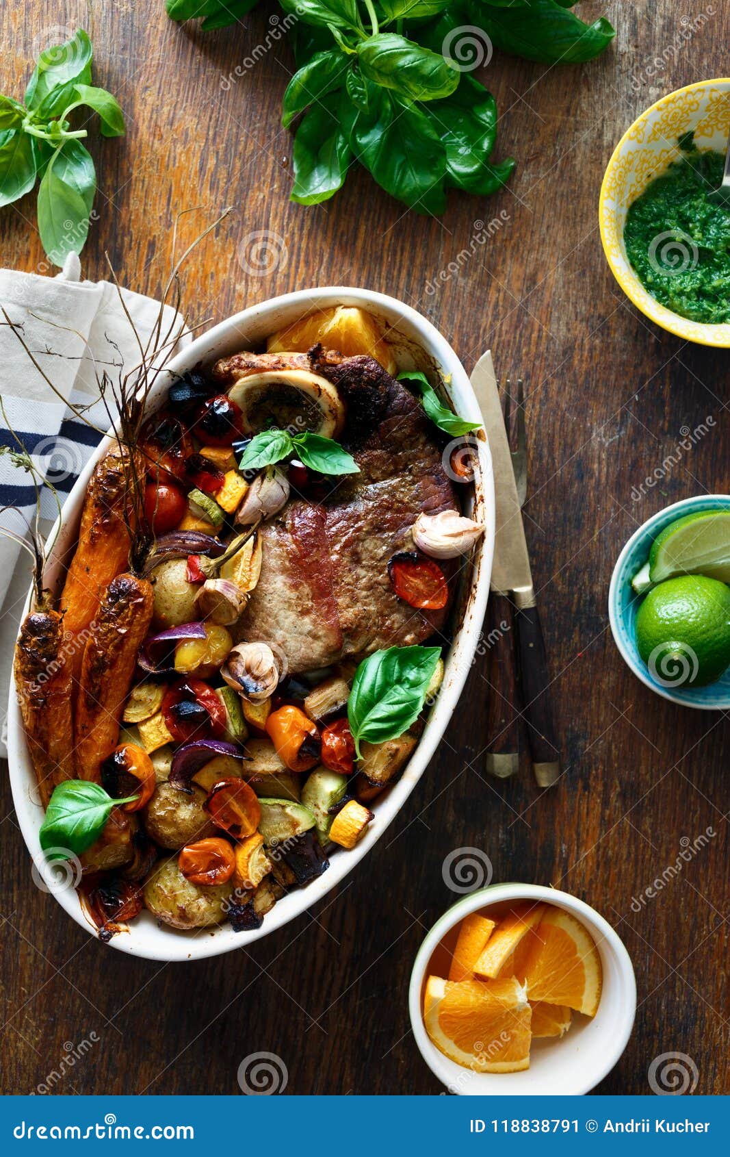 healthy beef meat baked vegetables ceramic pot wooden table sauc