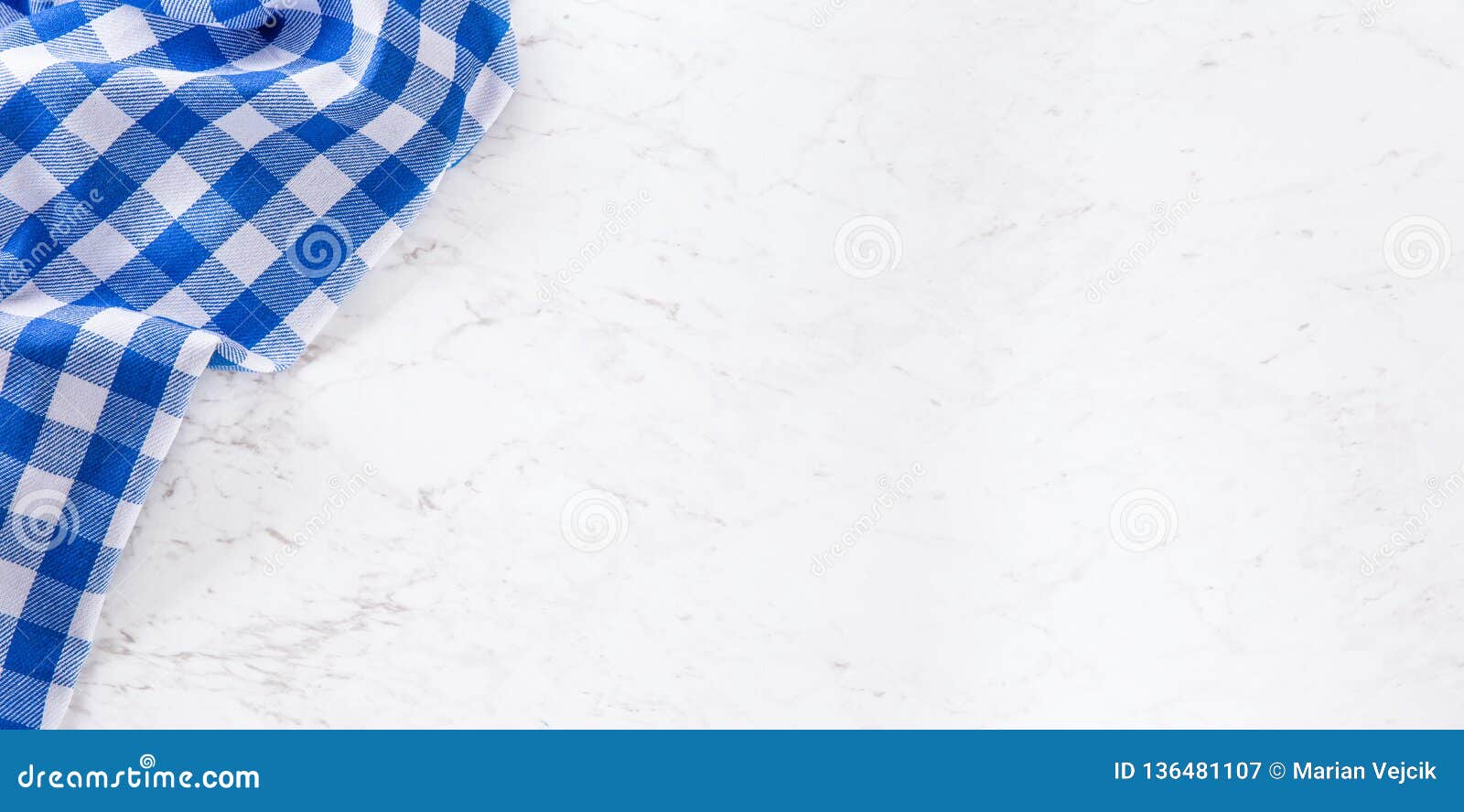 top of view blue checkered tablecloth on white marble table